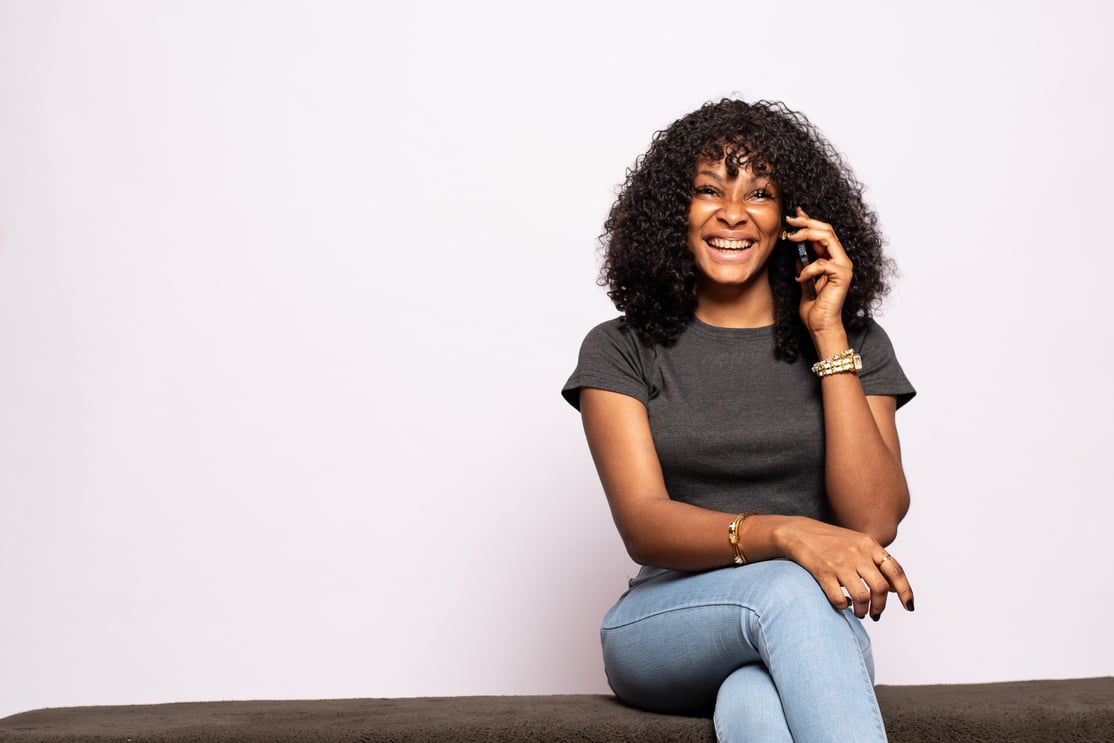 beautiful young black lady making a phone call