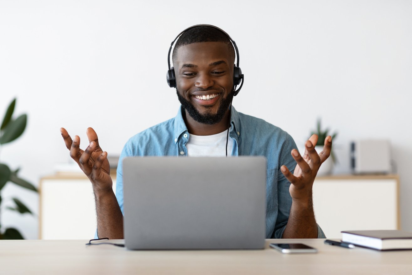 Video Call. Cheerful African Man Having Online Meeting With Laptop At Home